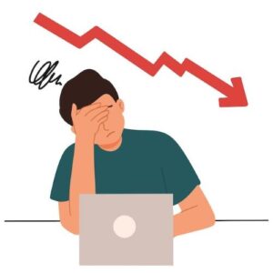 Stressed business owner looking at falling SEO ranking chart on laptop